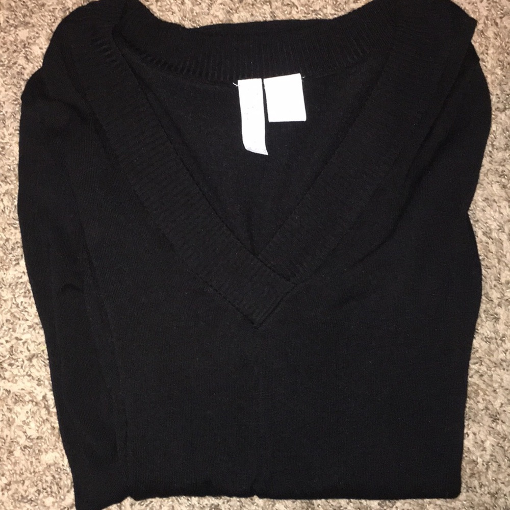 Long sleeve black sweater. Long for leggings.